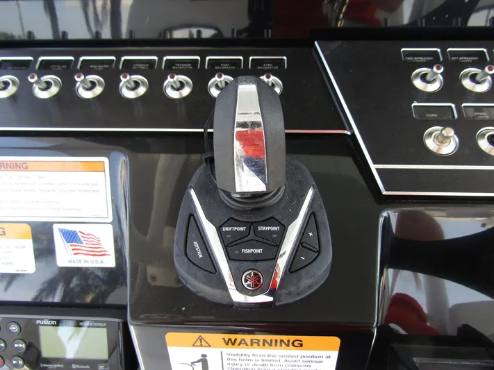  Yacht Photos Pics Control panel of 2024 Wellcraft 352 Fisherman boat with joystick and switches.