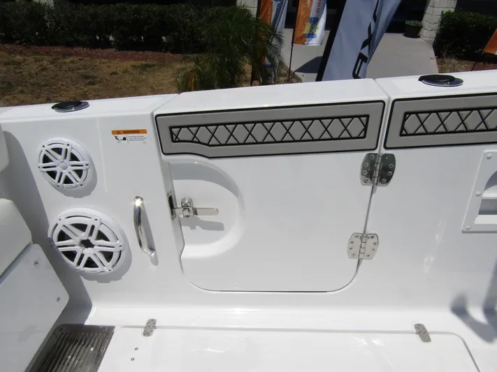  Yacht Photos Pics 2024 Wellcraft 352 Fisherman boat deck with speakers and storage compartments.