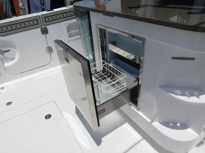  Yacht Photos Pics 2024 Wellcraft 352 Fisherman boat with open storage compartment.