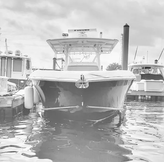  Yacht Photos Pics 2008 Midnight Express 37 boat docked in marina, front view, overcast sky.