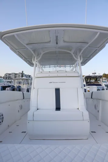  Yacht Photos Pics 2008 Midnight Express 37 boat with white seating and canopy at a marina.
