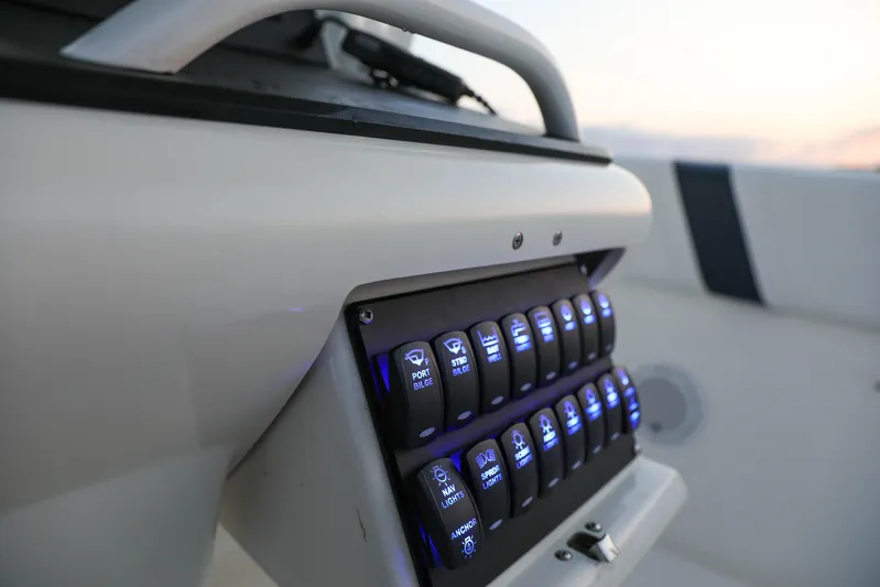  Yacht Photos Pics Control panel of a 2008 Midnight Express 37 boat with illuminated switches.