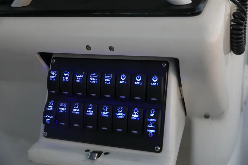  Yacht Photos Pics Control panel of a 2008 Midnight Express 37 boat with illuminated switches.