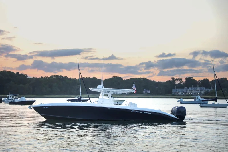  Yacht Photos Pics 2008 Midnight Express 37 boat on calm water at sunset.