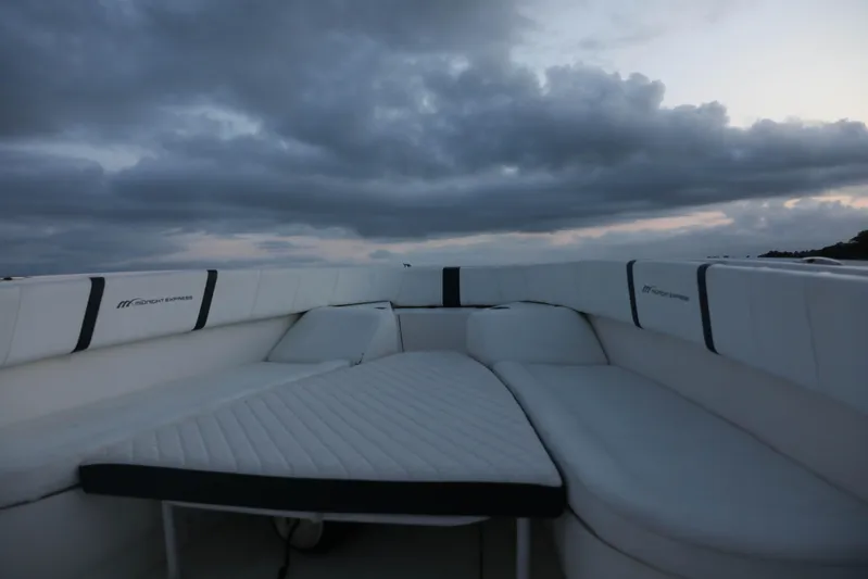  Yacht Photos Pics 2008 Midnight Express 37 boat interior with cushioned seating under cloudy sky.