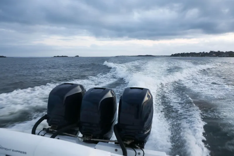  Yacht Photos Pics Midnight Express 37 boat, 2008 model, cruising on open water with three powerful engines.