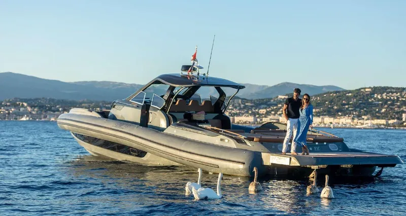 Stanislas Michel Yacht Photos Pics Luxury SACS Strider 18 yacht on water, 2016 model, with people enjoying the view.