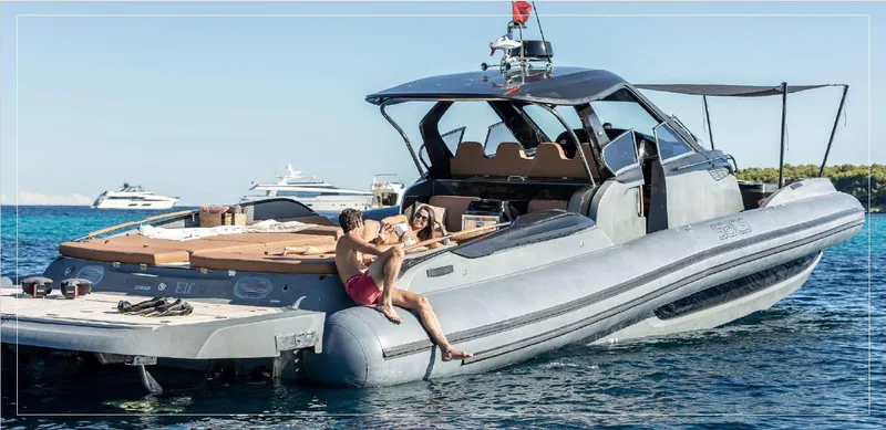 Stanislas Michel Yacht Photos Pics 2016 SACS Strider 18 yacht on water with people relaxing onboard.