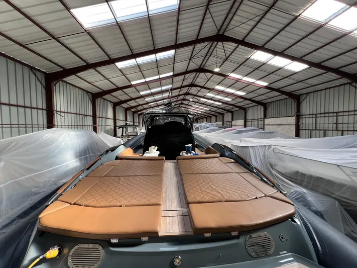 Stanislas Michel Yacht Photos Pics 2016 SACS Strider 18 boat in storage, covered and protected in a spacious warehouse.