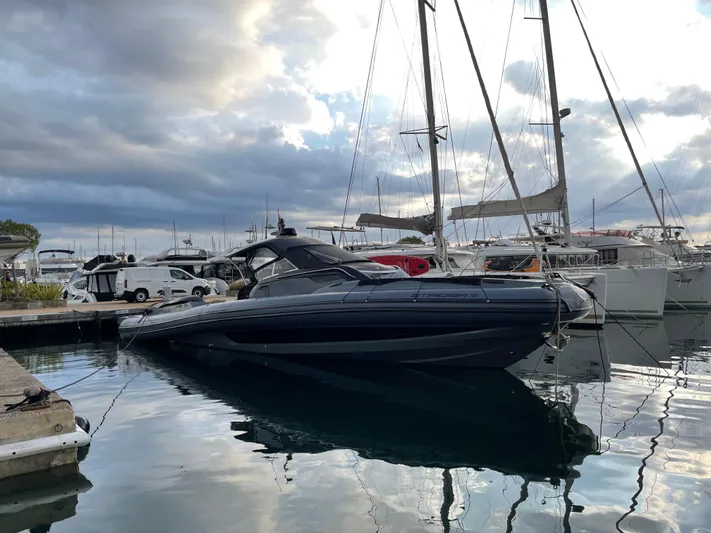 Stanislas Michel Yacht Photos Pics 2016 SACS Strider 18 luxury yacht docked in a marina under cloudy skies.