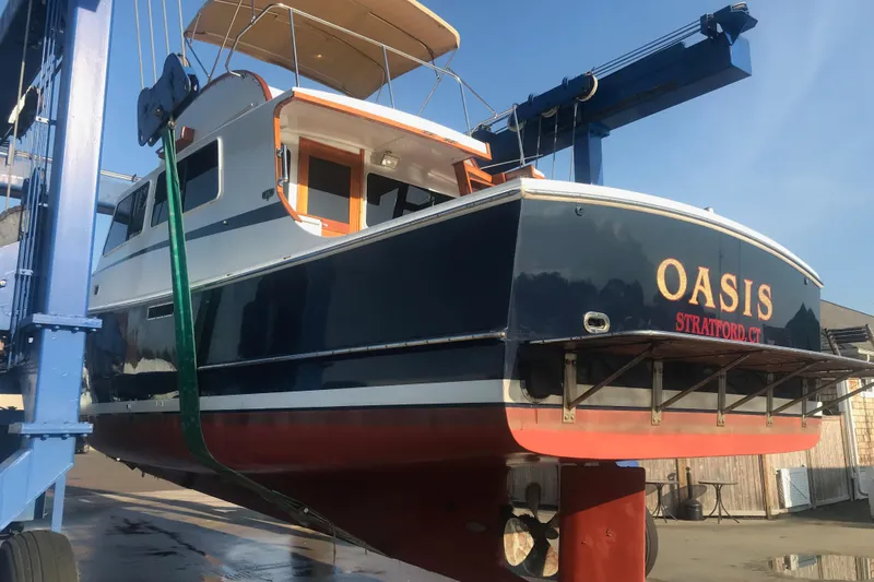 Oasis Yacht Photos Pics 1987 Wilbur 38 boat named "Oasis" in a boatyard lift, Stratford, CT.