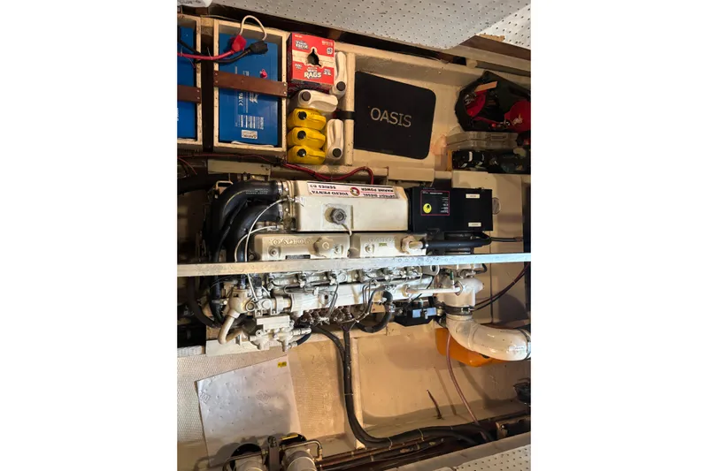 Oasis Yacht Photos Pics Engine room of a 1987 Wilbur 38 boat, featuring a detailed mechanical setup.