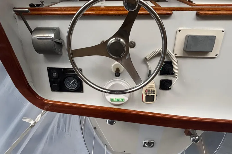 Oasis Yacht Photos Pics Steering wheel and controls of a 1987 Wilbur 38 boat.