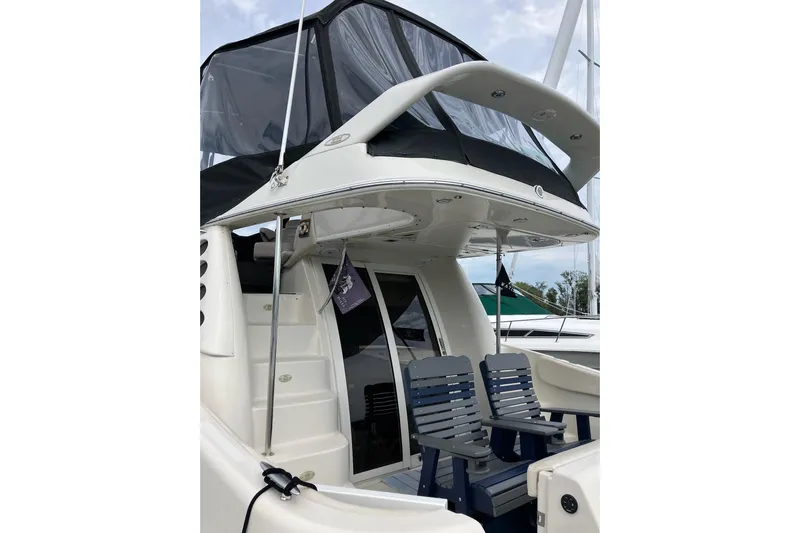 25 Knots Yacht Photos Pics 2001 Regal Commodore 3780 yacht with seating and covered upper deck.