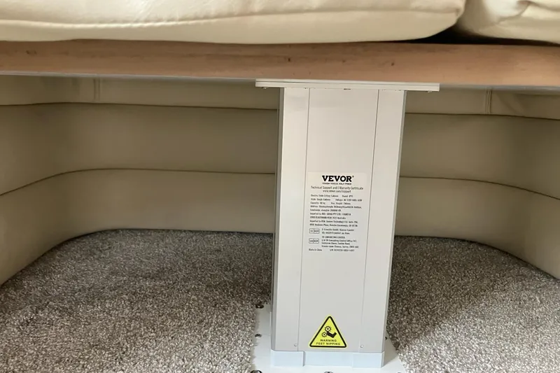 25 Knots Yacht Photos Pics Under-seat storage area in 2001 Regal Commodore 3780 with Vevor lift mechanism.