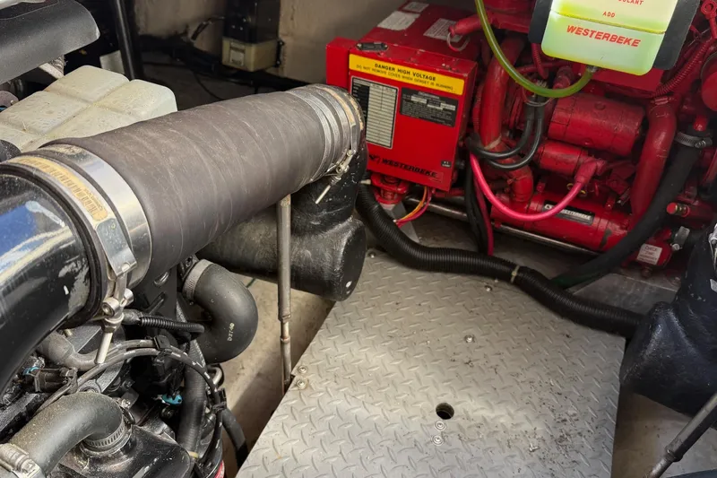 25 Knots Yacht Photos Pics Engine compartment of 2001 Regal Commodore 3780 with Westerbeke generator and components.