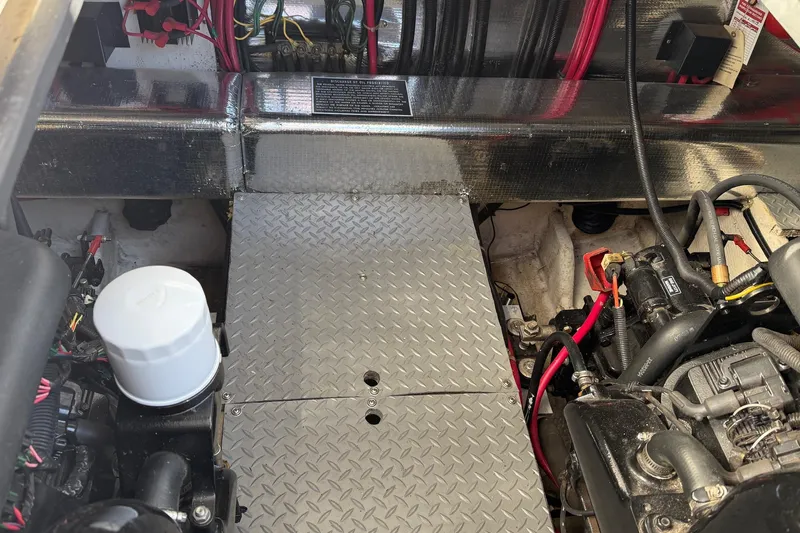 25 Knots Yacht Photos Pics Engine compartment of a 2001 Regal Commodore 3780 boat, featuring mechanical components and wiring.