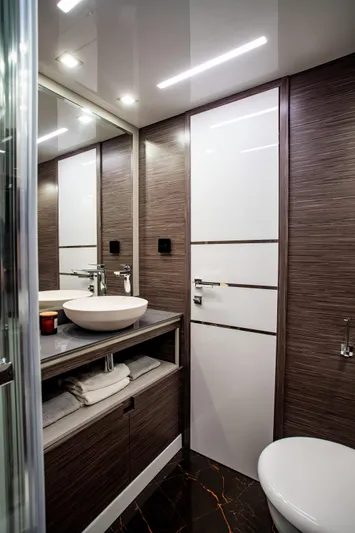 Custom Order Yours Today! Yacht Photos Pics Luxurious bathroom interior of 2026 Cobrey 45 Fly yacht with modern fixtures.