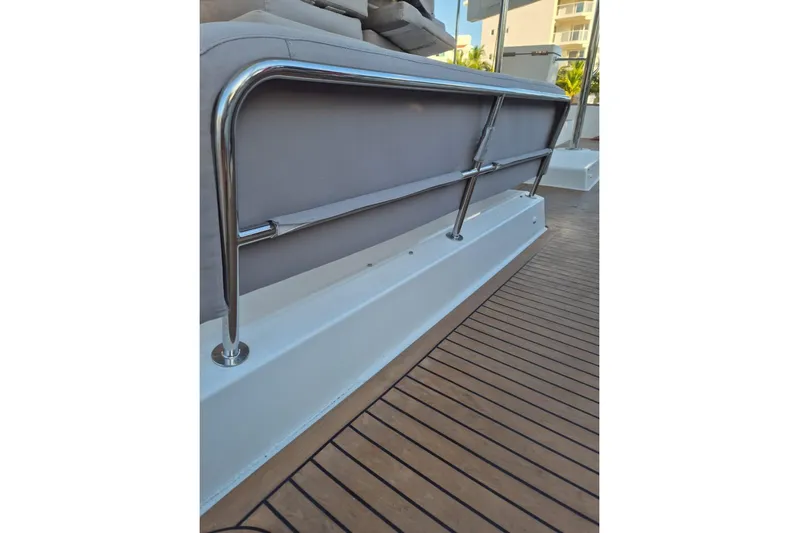 Chapter Two Yacht Photos Pics 2014 Lagoon 450 yacht deck with stainless steel railing and wooden flooring.