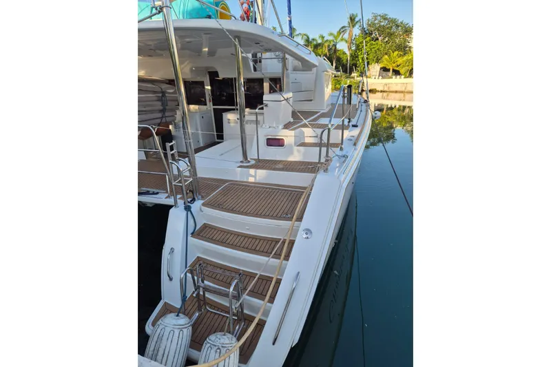 Chapter Two Yacht Photos Pics 2014 Lagoon 450 catamaran docked, featuring spacious deck and modern design.