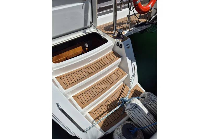 Chapter Two Yacht Photos Pics Steps on a 2014 Lagoon 450 yacht with wooden finish and safety equipment.