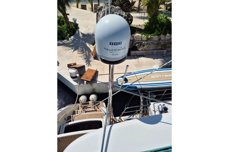 Chapter Two Yacht Photos Pics Lagoon 450 yacht with TracVision satellite, docked near tropical foliage, 2014 model.