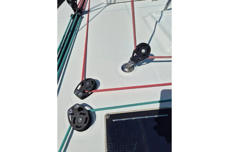 Chapter Two Yacht Photos Pics Deck of 2014 Lagoon 450 catamaran with colorful rigging and pulleys.