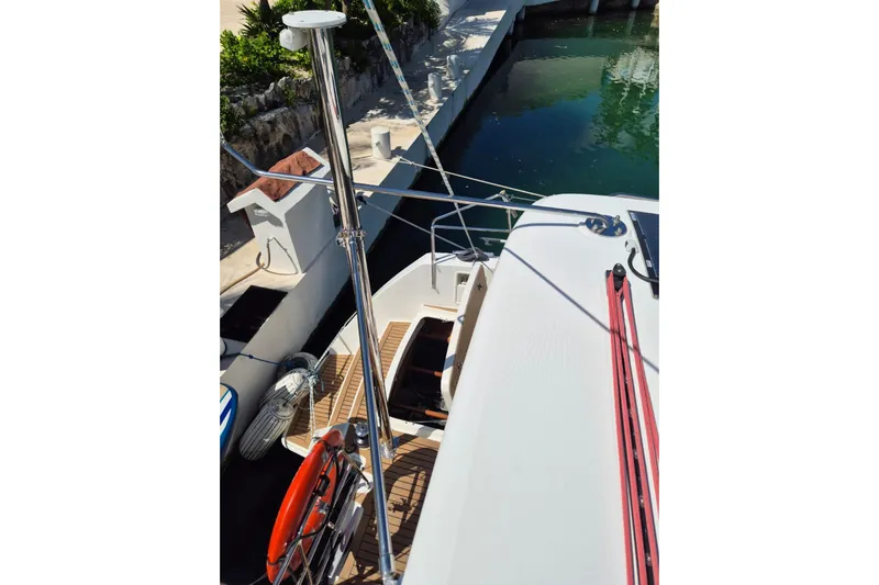 Chapter Two Yacht Photos Pics 2014 Lagoon 450 catamaran docked, showing deck and mooring lines.