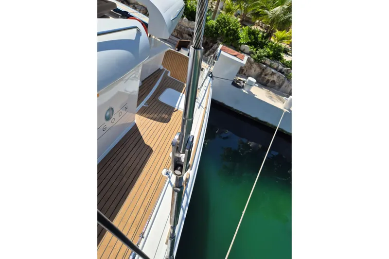 Chapter Two Yacht Photos Pics 2014 Lagoon 450 catamaran docked, showcasing sleek deck and vibrant surroundings.