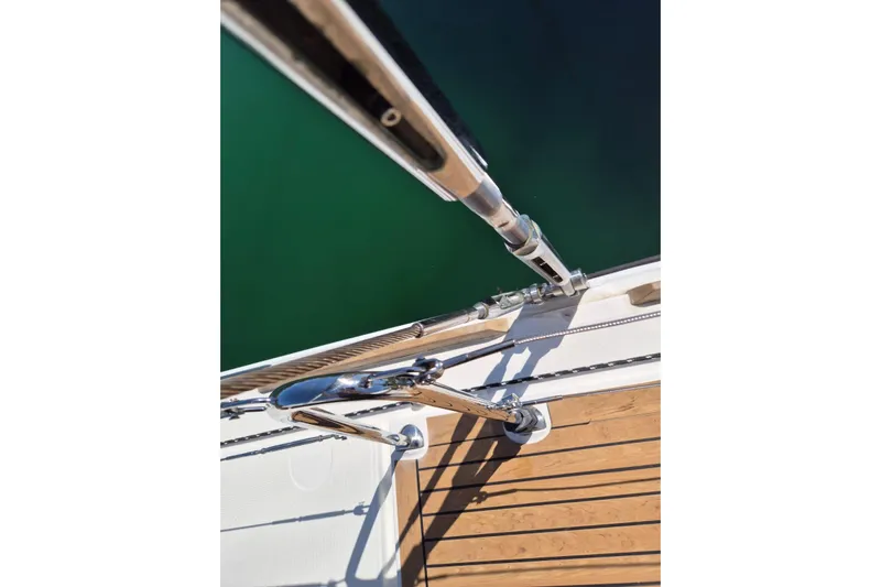 Chapter Two Yacht Photos Pics Deck view of 2014 Lagoon 450 yacht with stainless steel railings and wooden flooring.
