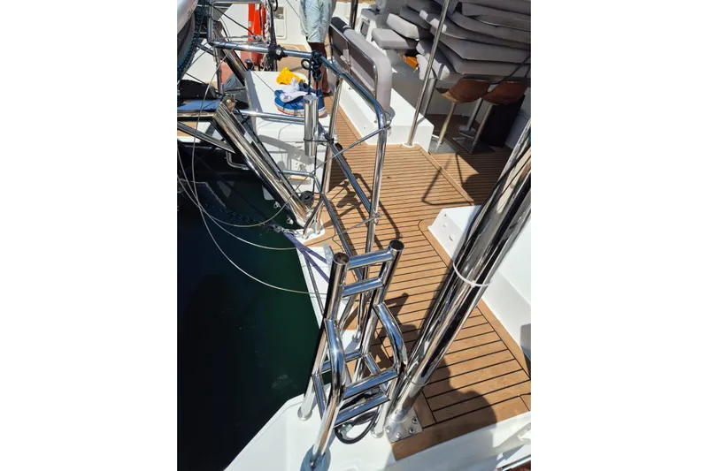 Chapter Two Yacht Photos Pics Lagoon 450 catamaran deck with stainless steel ladder and wooden flooring, 2014 model.