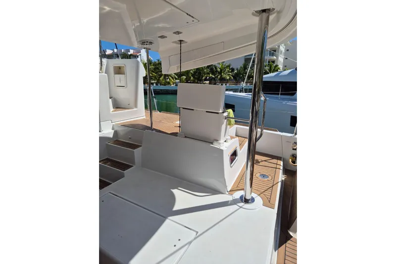 Chapter Two Yacht Photos Pics 2014 Lagoon 450 yacht deck with seating and polished metal railings.