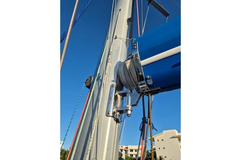 Chapter Two Yacht Photos Pics Mast and rigging of a 2014 Lagoon 450 catamaran against a clear blue sky.