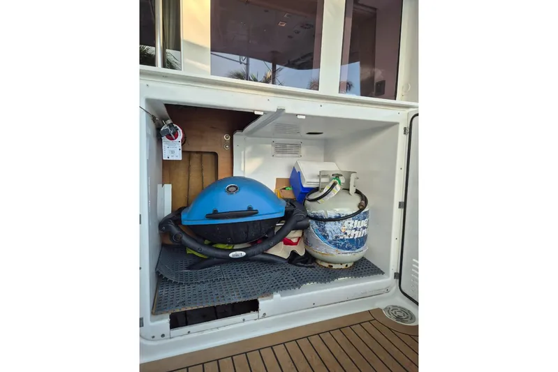 Chapter Two Yacht Photos Pics Storage compartment on 2014 Lagoon 450 yacht with grill and propane tank.