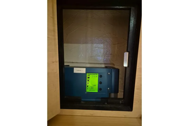 Chapter Two Yacht Photos Pics Electrical panel inside a 2014 Lagoon 450 catamaran, featuring a charger display.