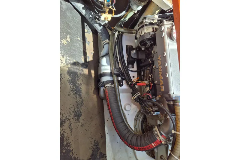 Chapter Two Yacht Photos Pics Engine compartment of a 2014 Lagoon 450 catamaran, featuring a Yanmar engine.