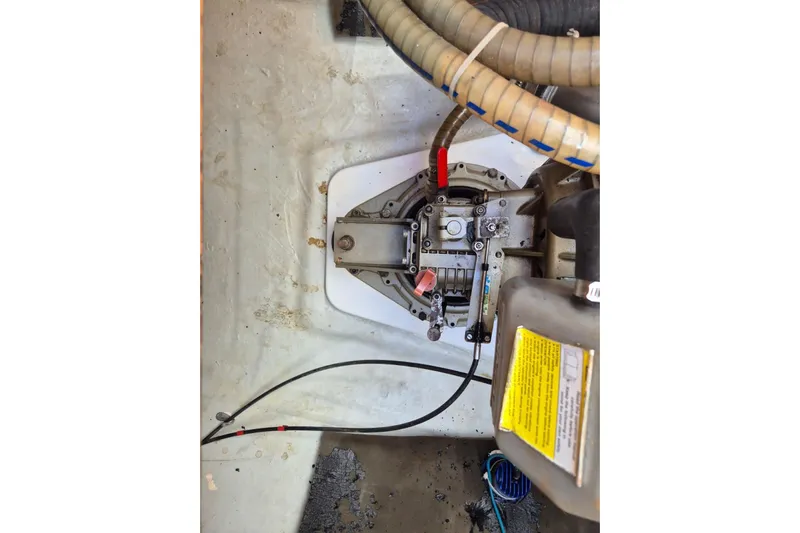 Chapter Two Yacht Photos Pics Engine compartment of a 2014 Lagoon 450 catamaran, showing mechanical components and hoses.