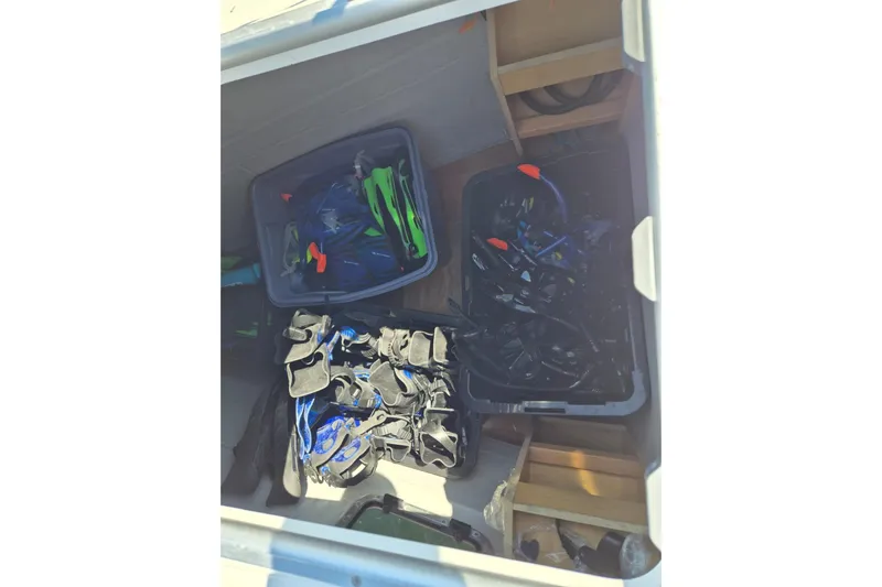 Chapter Two Yacht Photos Pics Storage compartment on 2014 Lagoon 450 yacht with snorkeling gear and equipment.