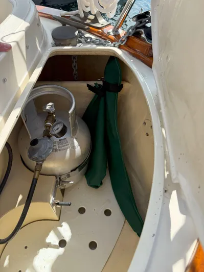 Dalliance Yacht Photos Pics Storage compartment on a 1993 Pacific Seacraft Crealock 34 sailboat with propane tank.