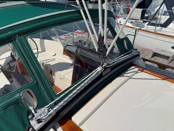 Dalliance Yacht Photos Pics Sailboat cockpit with green canopy, rigging, and winch on a 1993 Pacific Seacraft Crealock 34.