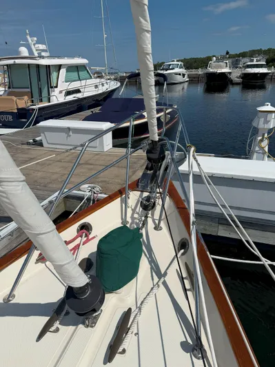 Dalliance Yacht Photos Pics Sailboat docked at marina, Pacific Seacraft Crealock 34, 1993 model, clear sky.