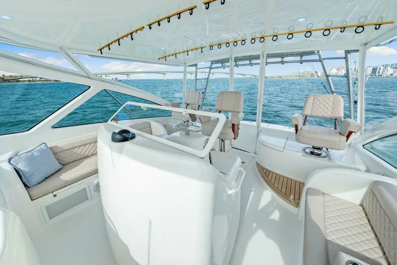 Bad Habit Yacht Photos Pics Luxurious interior of 2012 Viking 42 Open yacht with plush seating and ocean view.