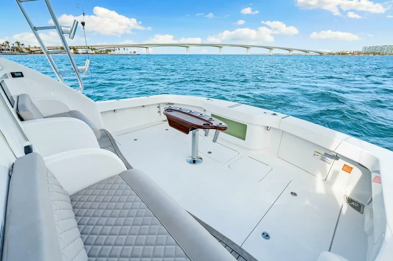 Bad Habit Yacht Photos Pics 2012 Viking 42 Open yacht deck with ocean view and bridge in background.