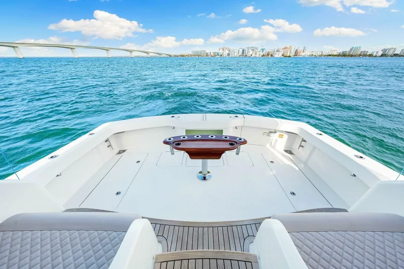 Bad Habit Yacht Photos Pics 2012 Viking 42 Open yacht deck with ocean view and city skyline.