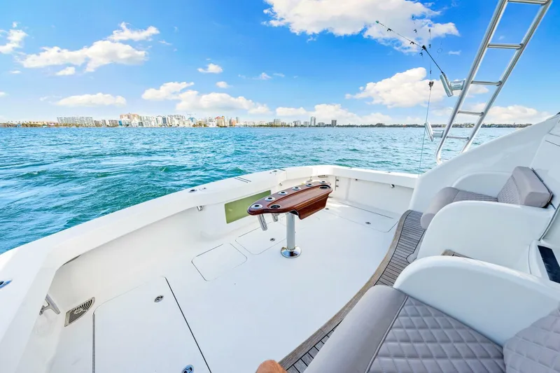 Bad Habit Yacht Photos Pics 2012 Viking 42 Open yacht deck with ocean view and city skyline.