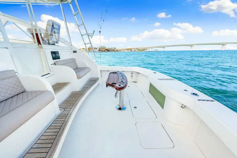 Bad Habit Yacht Photos Pics 2012 Viking 42 Open yacht interior with seating, ocean view, and clear blue sky.