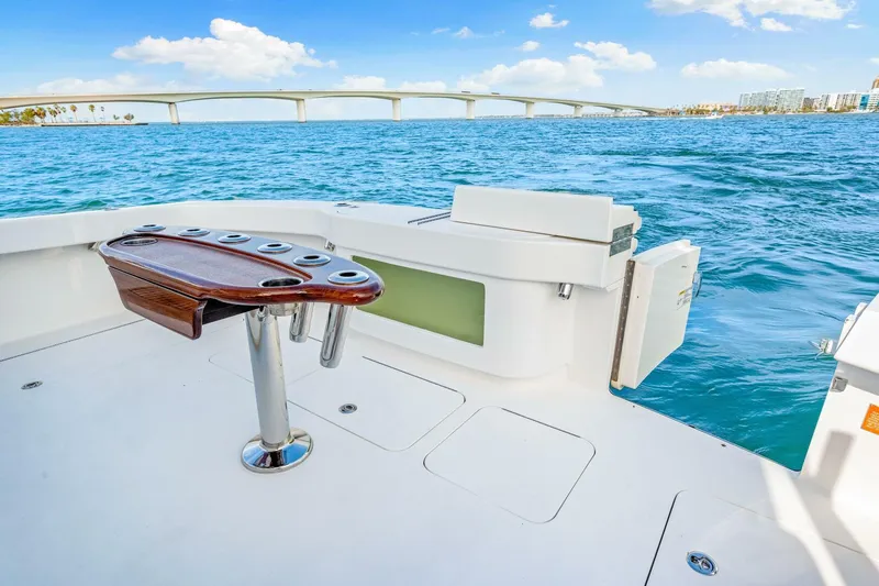 Bad Habit Yacht Photos Pics 2012 Viking 42 Open yacht deck with ocean view and bridge in background.