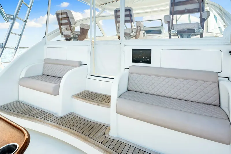 Bad Habit Yacht Photos Pics 2012 Viking 42 Open yacht interior with cushioned seating and wooden flooring.