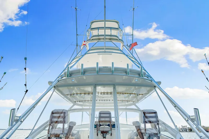 Bad Habit Yacht Photos Pics 2012 Viking 42 Open yacht with tower against blue sky and clouds.