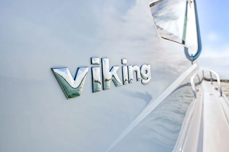 Bad Habit Yacht Photos Pics 2012 Viking 42 Open yacht with chrome logo on hull.